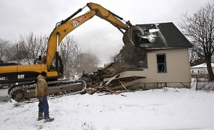 A house in Detroit is demolished (Carlos Osorio/AP)