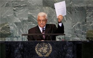 Palestinian President Mahmoud Abbas holds up a copy of a letter formally requesting U.N. membership for a Palestinian state at the General Assembly on September 23, 2011 (Mike Segar/Reuters)