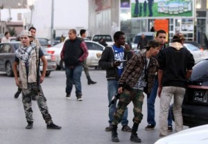 Militia members man a checkpoint in Tripoli, Libya (Mahmud Turkia, AFP)