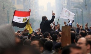 Supporters of Egypt's Muslim Brotherhood shout slogans outside the parliament in Cairo on January 23, 2012. (Photo: Mahmud Hams)