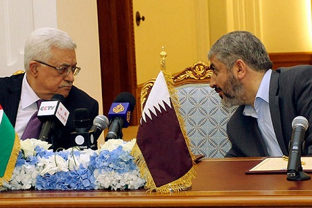 Palestinian President Mahmoud Abbas and Hamas leader Khaled Meshaal in Doha, Qatar, where they signed an agreement to form a unity government (Reuters)