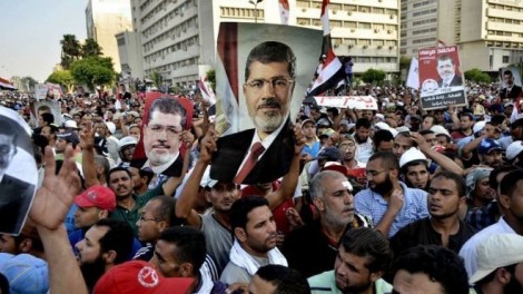Supporters of Mohamed Morsi march in Cairo on July 5, 2013 (AFP)