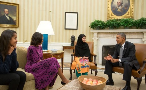 United States President Barack Obama, First Lady Michelle Obama, and their daughter Malia meet with Malala Yousafzai, a young Pakistani schoolgirl who was shot in the head by the Taliban in 2012, in the Oval Office on 11 October 2013 (Pete Souza/The White House)