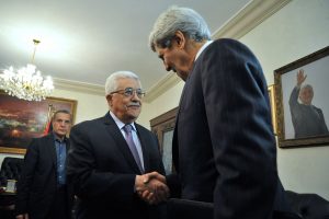 Palestinian Authority President Mahmoud Abbas greets U.S. Secretary of State John Kerry as he arrives for a meeting in Amman, Jordan, on June 29, 2013. (US Department of State)