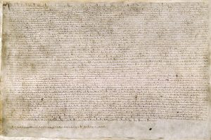 The Magna Carta (originally known as the Charter of Liberties) of 1215, written in iron gall ink on parchment in medieval Latin, using standard abbreviations of the period, authenticated with the Great Seal of King John. (British Library/Public Domain)
