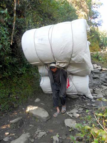 Superhuman loads hauled by superhuman porters of Nepal (Photo: Alonzo Lyons)