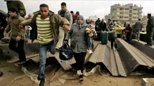 Gazans toppled the wall on the border with Egypt after Israel's assault in January 2008 (Hatem Moussa/AP)