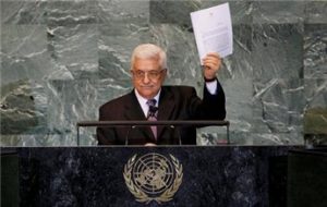 Palestinian President Mahmoud Abbas holds up a copy of a letter formally requesting U.N. membership for a Palestinian state at the General Assembly on September 23, 2011 (Mike Segar/Reuters)