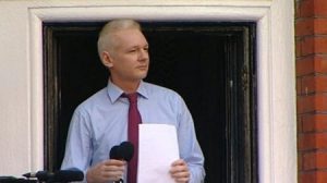 Julian Assange speaks to a crowd from the Ecuadorian embassy in London on August 19, 2012