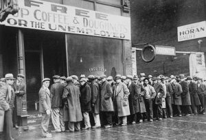 Unemployed men stand in line outside a soup kitchen opened in Chicago by Al Capone during the Great Depression, February 1931 (US Information Agency)