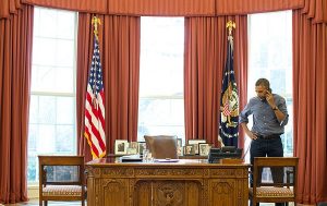 U.S. President Barack Obama talks on the phone in the Oval Office with Russian President Vladimir Putin about the situation in Ukraine, March 1, 2014. (Pete Souza/White House)
