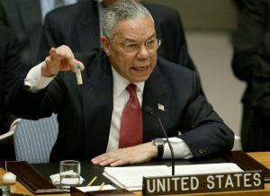 The U.S. waged an illegal war of aggression on Iraq based on a pretext of lies. Here, then Secretary of State Colin Powell presents the U.S. case for war to the U.N. Security Council on February 5, 2003.