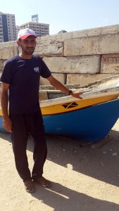 Mohammed Zeyad with his damaged boat.