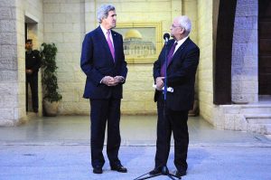 Palestinian Authority Lead Negotiator Saeb Erekat faces U.S. Secretary of State John Kerry as both address reporters following a meeting focused on Middle East peace at the Muqata'a Presidential Compound in Ramallah, West Bank, on January 4, 2013. (US State Department)