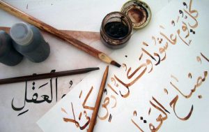 The work of a student of Arabic calligraphy, using bamboo pens (qalams) and brown ink, tracing over the teacher's work in black ink. (Photo: Aieman Khimji)
