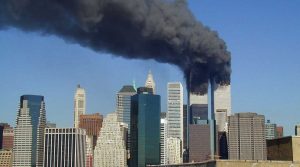 Plumes of smoke billow from the World Trade Center towers in Lower Manhattan, New York City, after a Boeing 767 hits each tower during the September 11 attacks. (Michael Foran/licensed under CC BY 2.0)