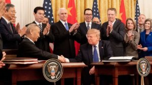 Chinese Vice Premier Liu He shakes hands with US President Donald Trump during a signing ceremony for a trade agreement on January 15, 2020 (D. Myles Cullen/White House)